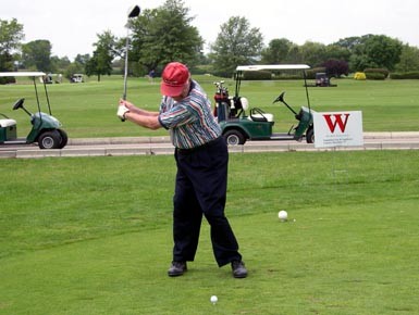Bob Christian '48 delivers a tee shot down the middle